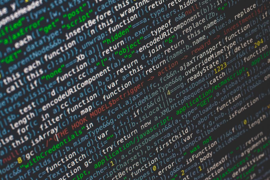 Close-up of colorful programming code displayed on a computer screen.