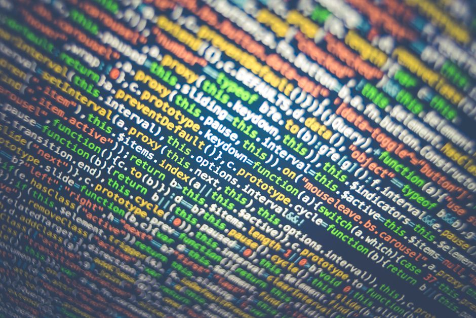 Vibrant multicolored source code displayed on a computer screen, depicting programming and web development concepts.